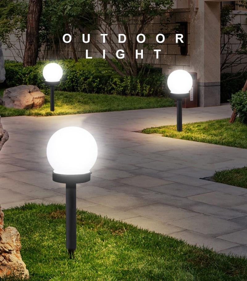 Liv solar pathway lamps lighting a curved garden walkway at night