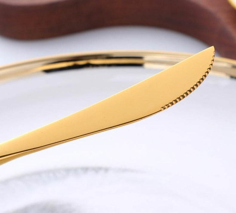 Nyland gold stainless-steel knife blade detail with fine serrated edge