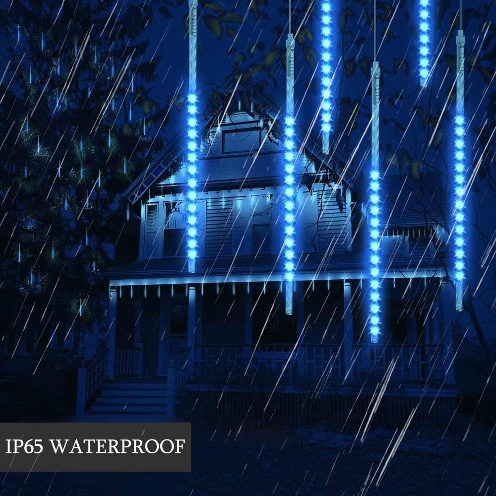 Blue LED icicle tube lights outdoors in heavy rain