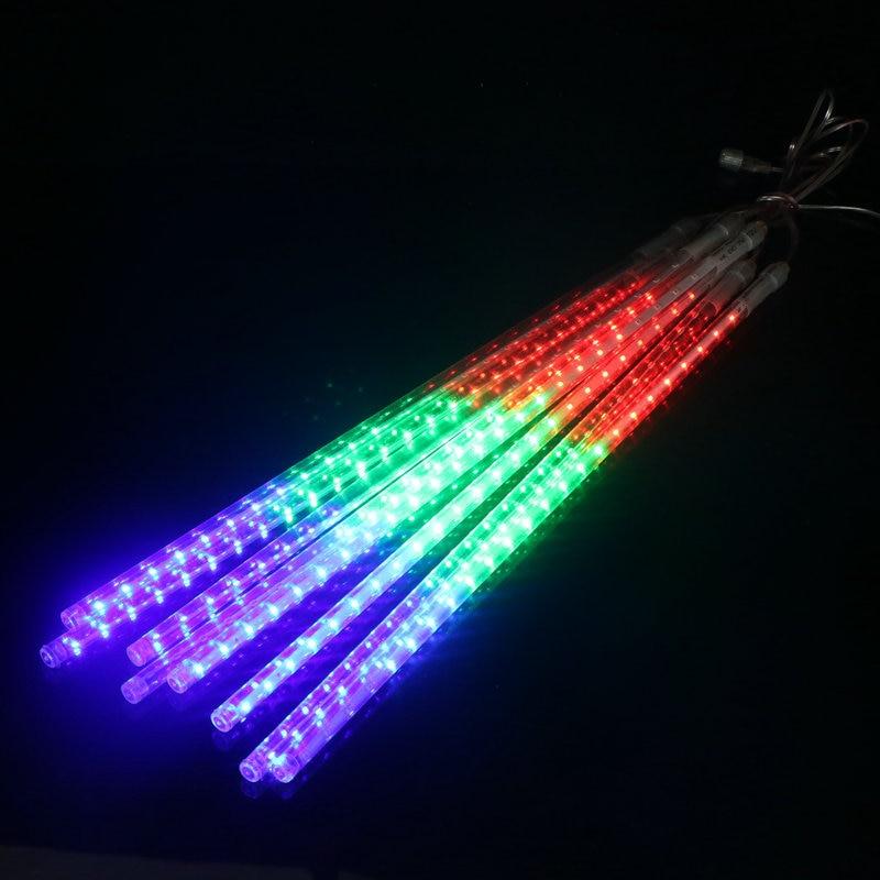 Eight bundled multicolor LED icicle tubes glowing on a black background