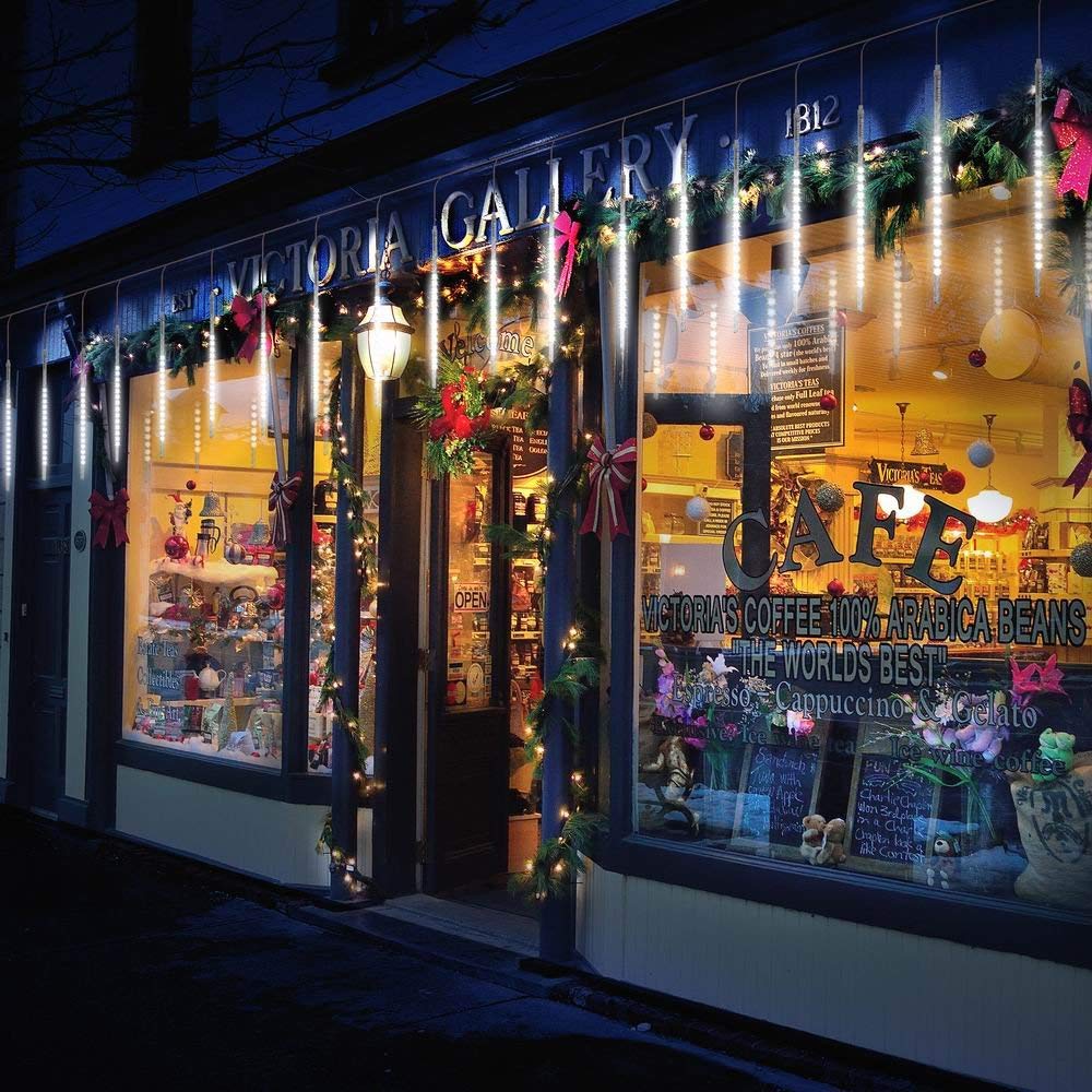 Multicolor LED icicle tube lights decorating a shopfront at night