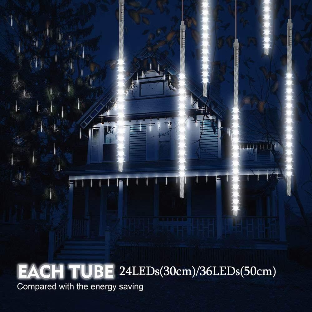 White LED icicle tube lights hanging outside a house at night