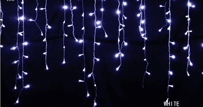 Ylva white LED curtain string lights shown as evenly spaced hanging strands