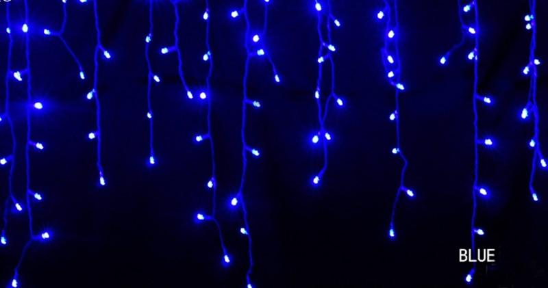 Ylva blue LED curtain string lights shown as bright hanging strands