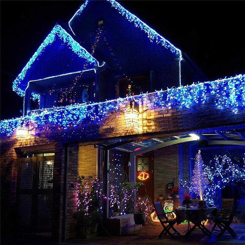 Ylva blue LED curtain lights outlining a house, balcony and covered patio