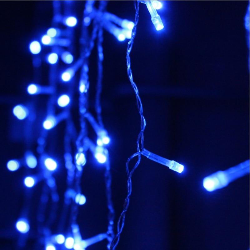 Ylva blue LED curtain light showing the twisted cable and clear bulb caps