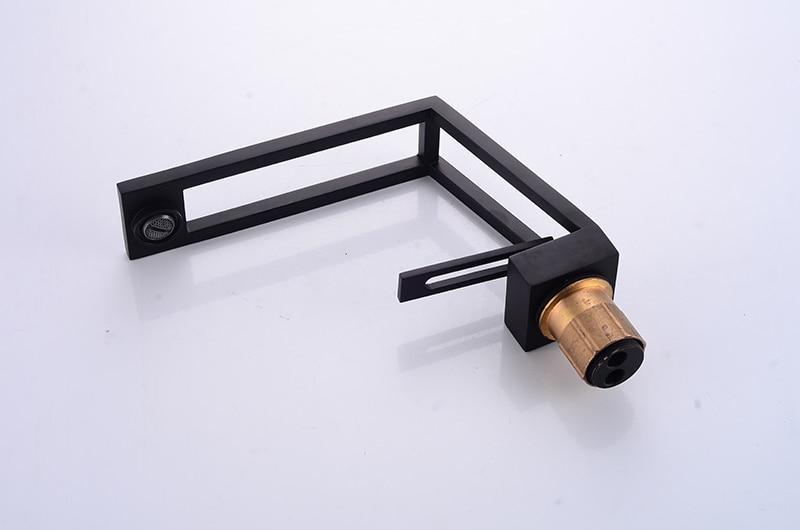 Black cut-out basin tap base, lever and inlet connection detail