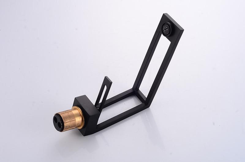 Black cut-out basin tap underside and threaded brass connection