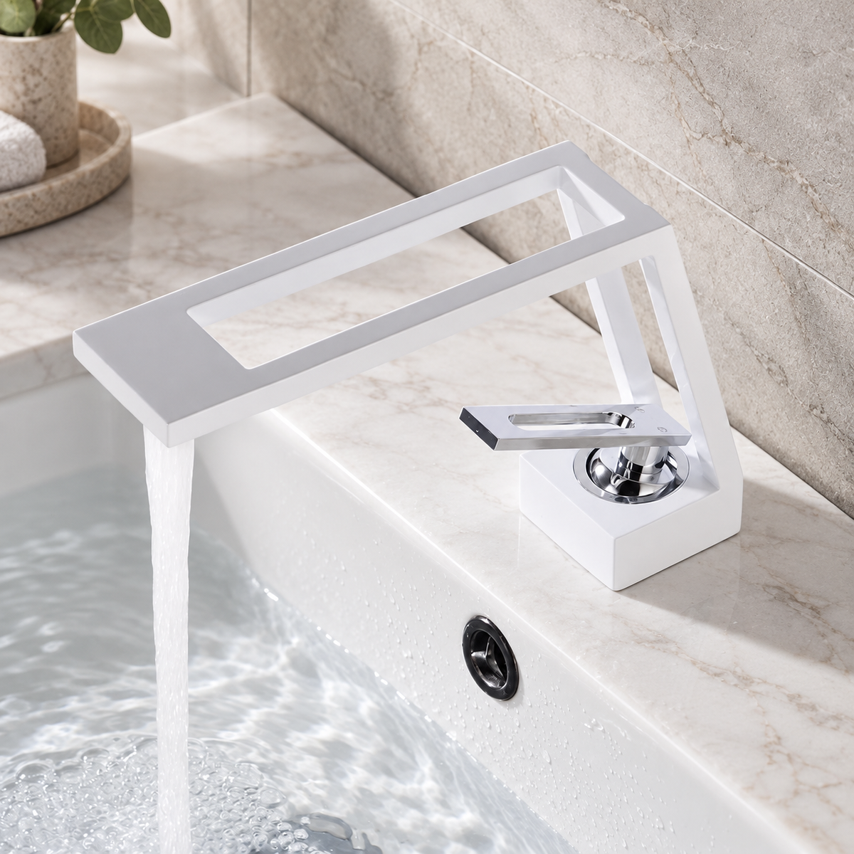 White cut-out basin tap running water into a modern ceramic basin