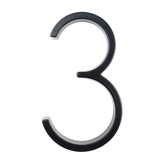 Black zinc alloy house number 3 isolated on a white background