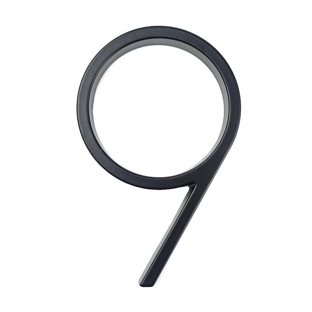 Black zinc alloy house number 9 isolated on a white background