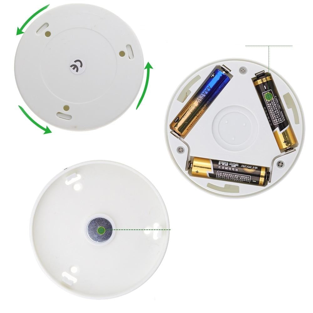 Kaja motion sensor night light showing battery compartment, mounting plate and sensor details