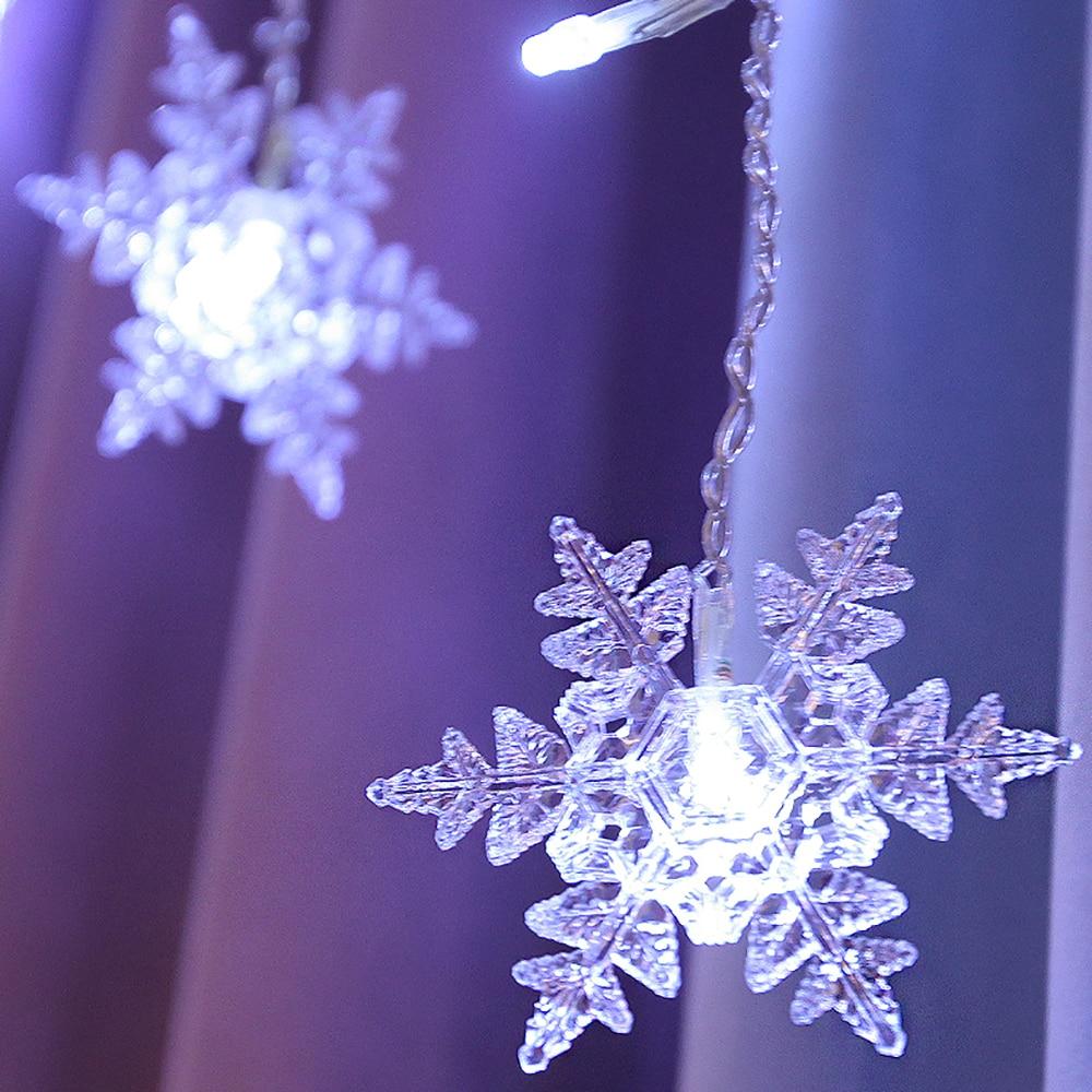 Torun snowflake LED string lights cold white pendant close-up with clear textured arms