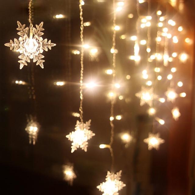 Torun snowflake LED string lights warm white pendant detail with clear molded snowflake