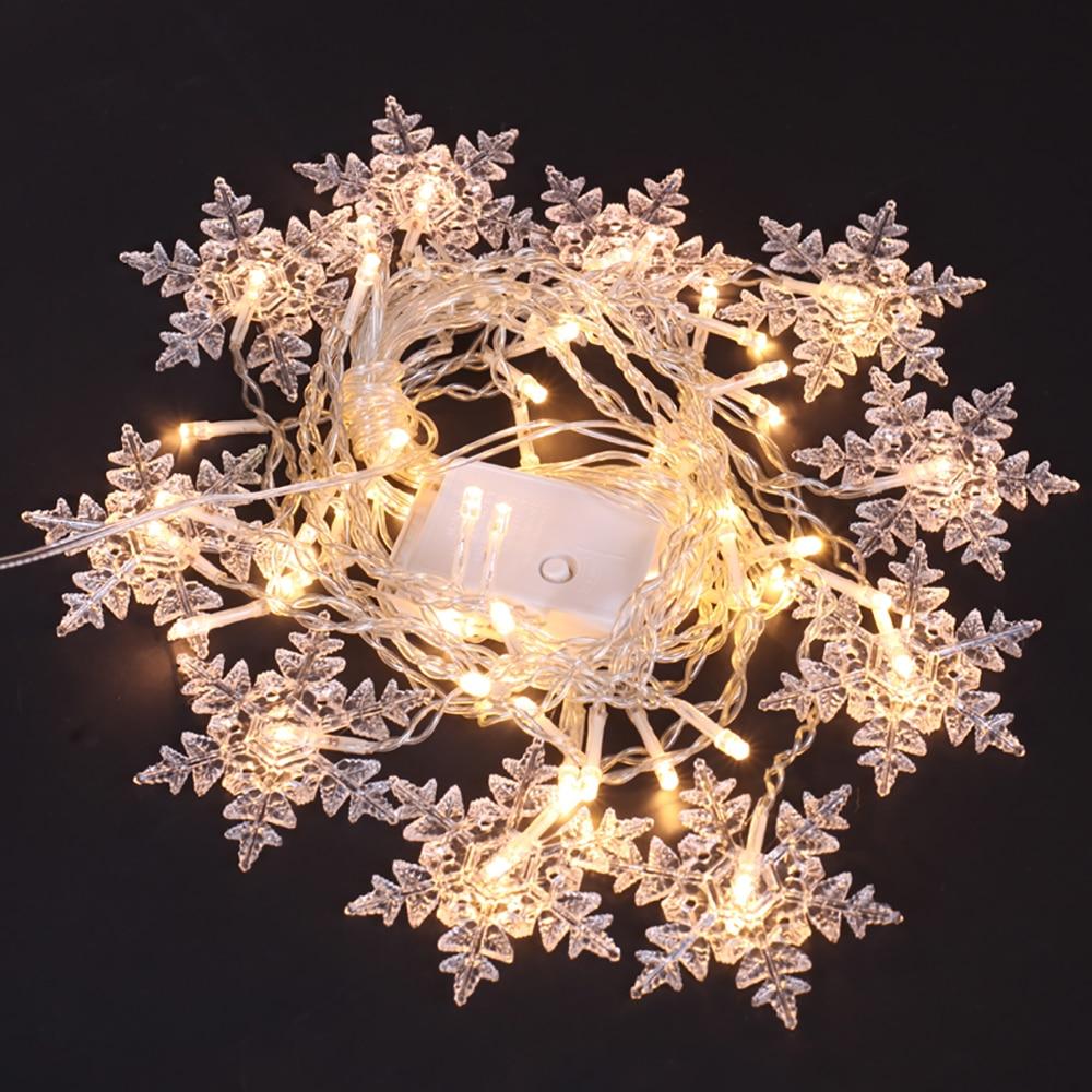 Torun snowflake LED string lights in warm white with clear cable and white controller