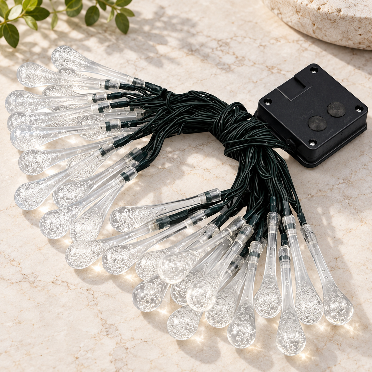 Sigrid solar droplet string lights with clear bulbs, black cable and controller