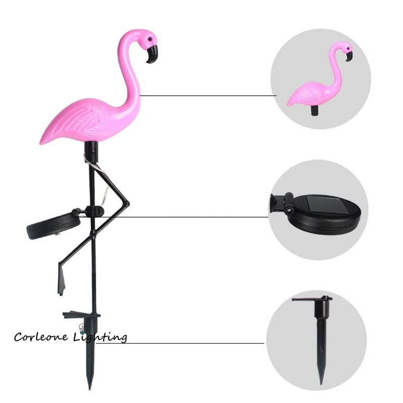 Solar flamingo garden stake light with callouts for body, solar panel and ground stake