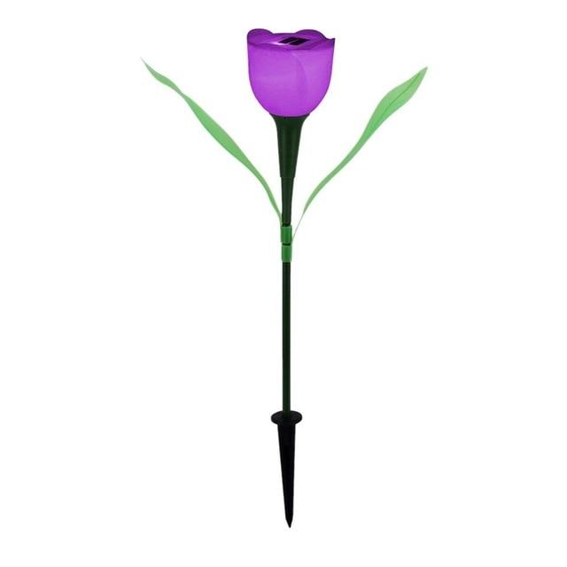 Purple solar tulip garden stake light with green leaves and black soil stake