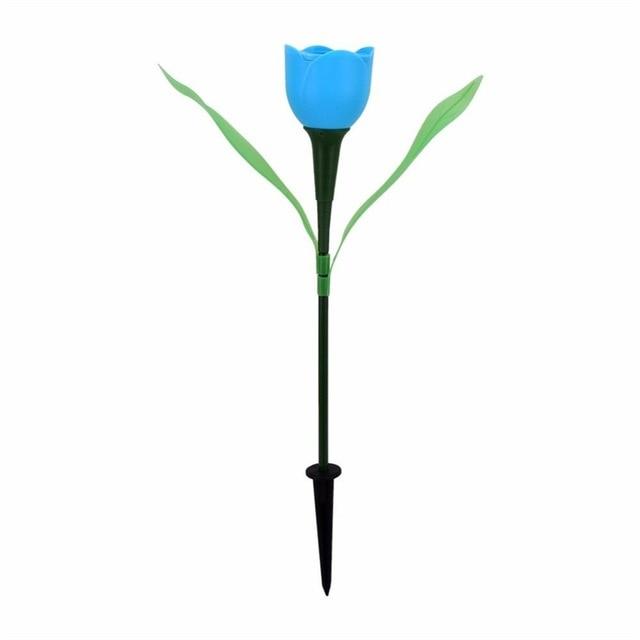 Blue solar tulip garden stake light with green leaves and black soil stake
