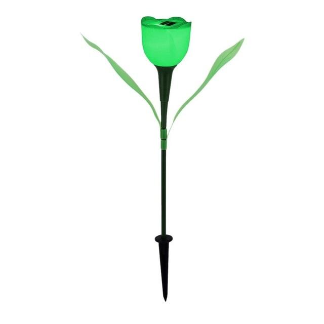 Green solar tulip garden stake light with green leaves and black soil stake