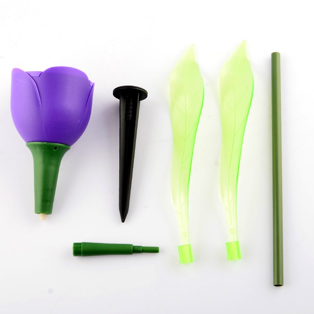 Purple solar tulip garden stake light shown disassembled with stem, leaves and soil stake